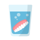 dentures in solution on white background